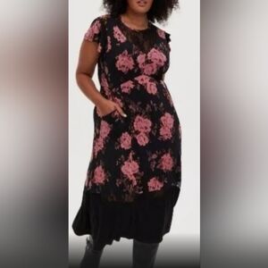 Torrid Studio floral dress. Size 3. Never worn. New with no tags. It has pockets
